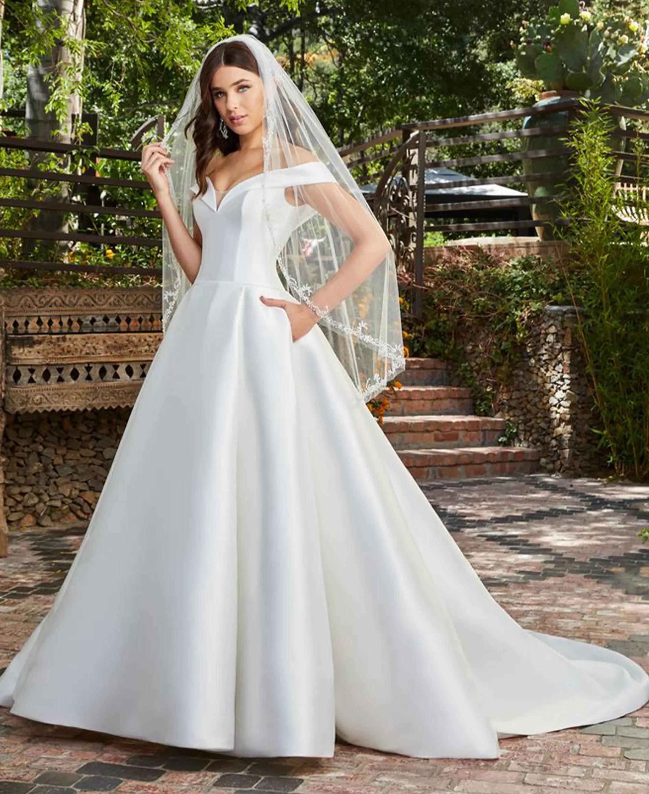 Model wearing white Casablanca Wedding Gown. Mobile